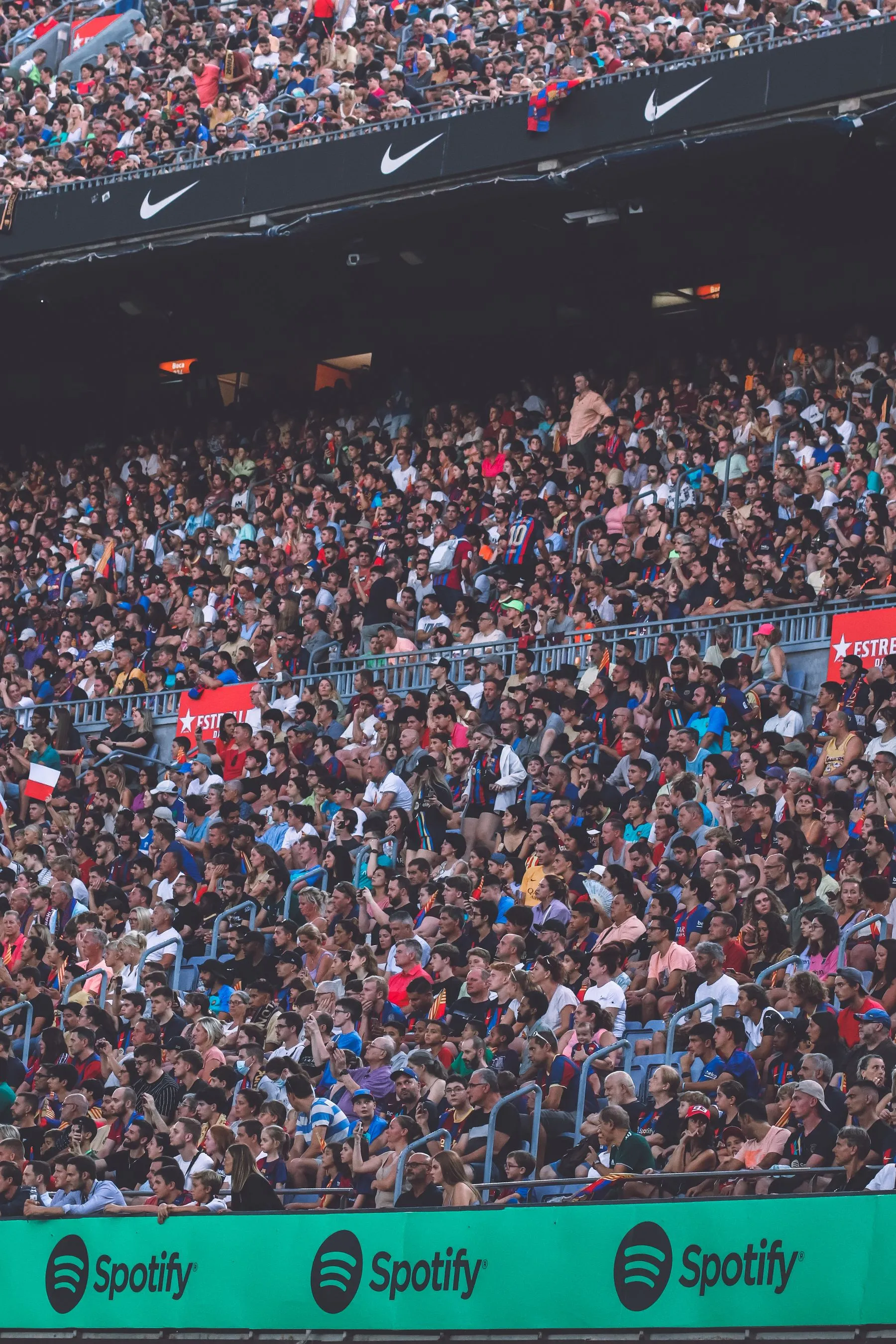 A large crowd filling a stadium at an event